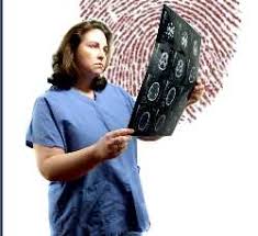nurse studying fingerprints for forensic nursing