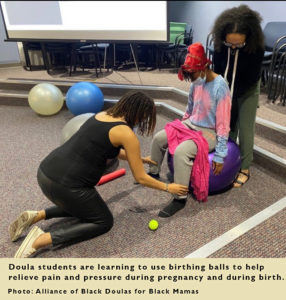 Doula students learn to use use birthing balls to help relieve pain and pressure during pregnancy and during birth.