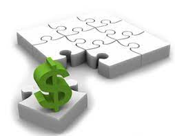 a white puzzle with one piece out of the puzzle and a green dollar sign on top representing a financial strategy