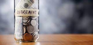 jar of coins with a paper label saying retirement